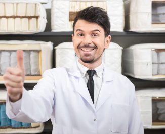 a person with commercial grad mattress materials behind him.