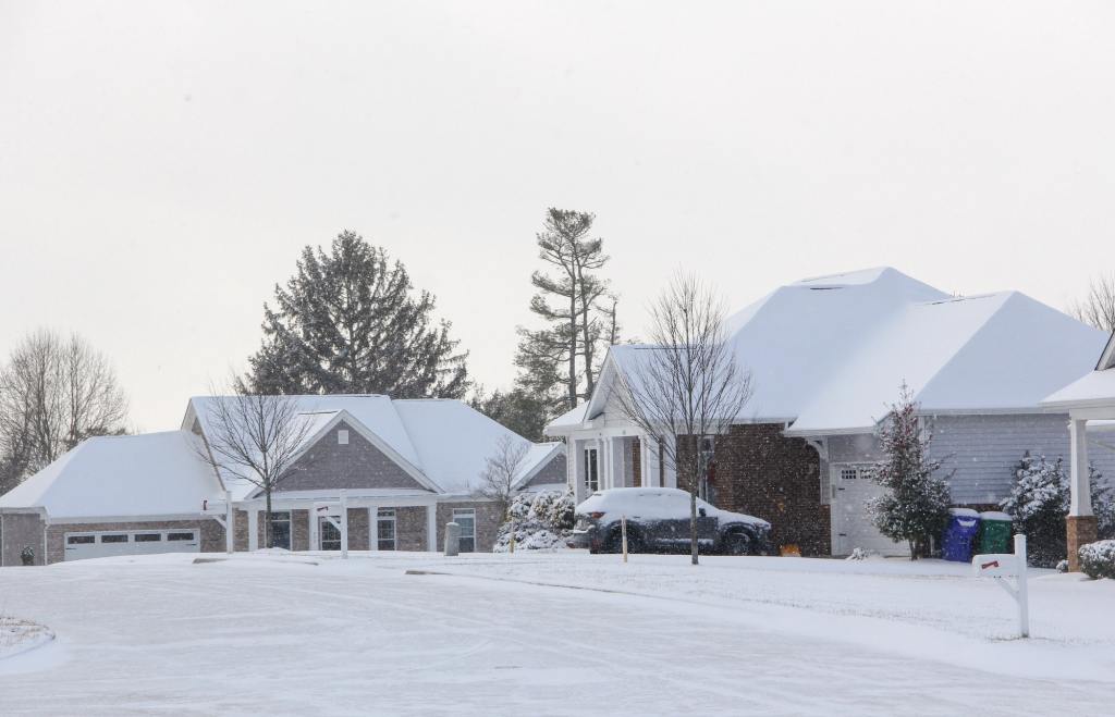 Snow-Covered Home. How To Upkeep Your Vacation Home.